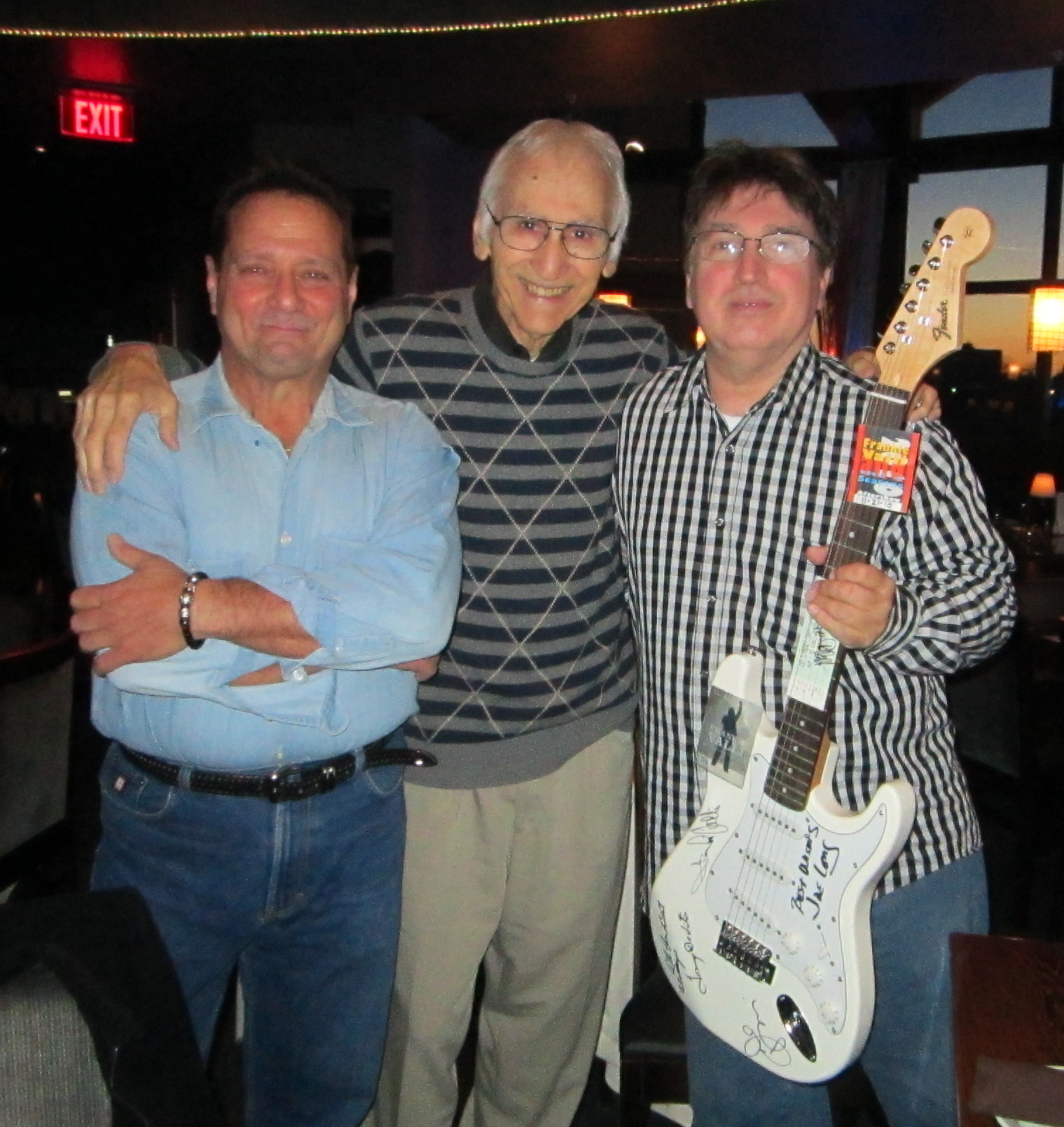 Joe Long with Jersey Four Cast Members Autographs Fender Guitar at McLoones